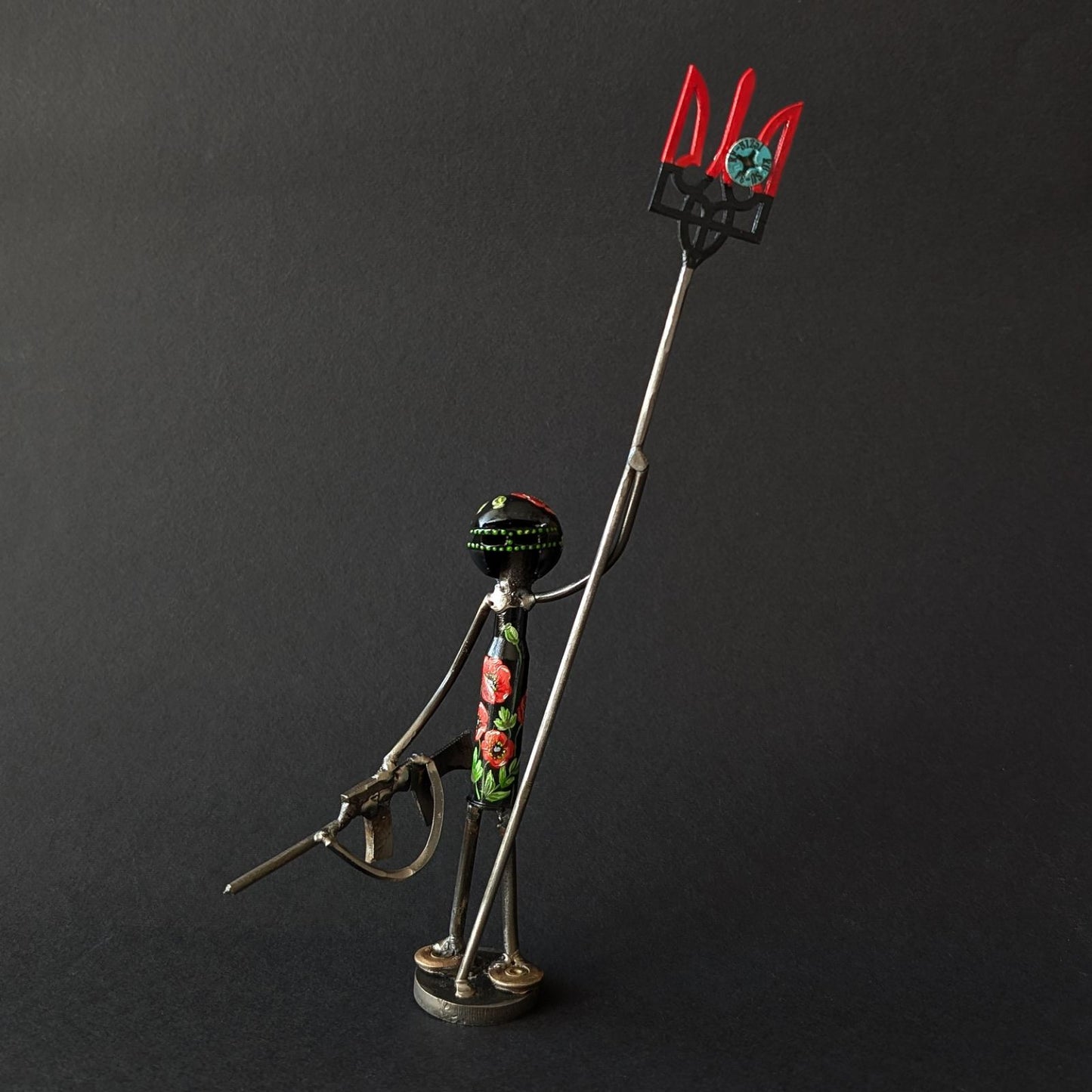 Mini-Soldier holding Tryzub with impaled screw from shot-down SU-34. (17cm tall). (1111 CR)