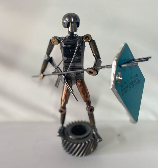 Soldado ucraniano sosteniendo un tryzub con un trozo empalado del SU-34 de un ork