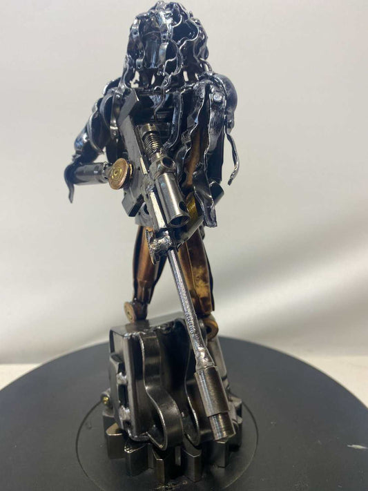 Sculpture of Ukrainian soldier in camouflage made from frontline shells, 27cm tall