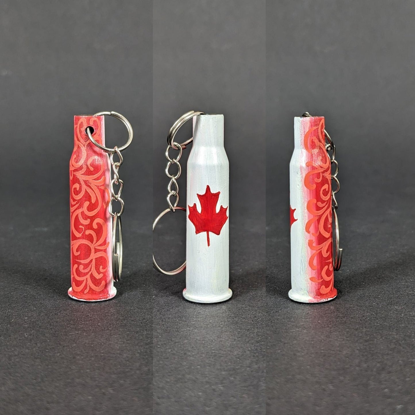 Small caliber keychain painted with Canadian flag colors representing Canada