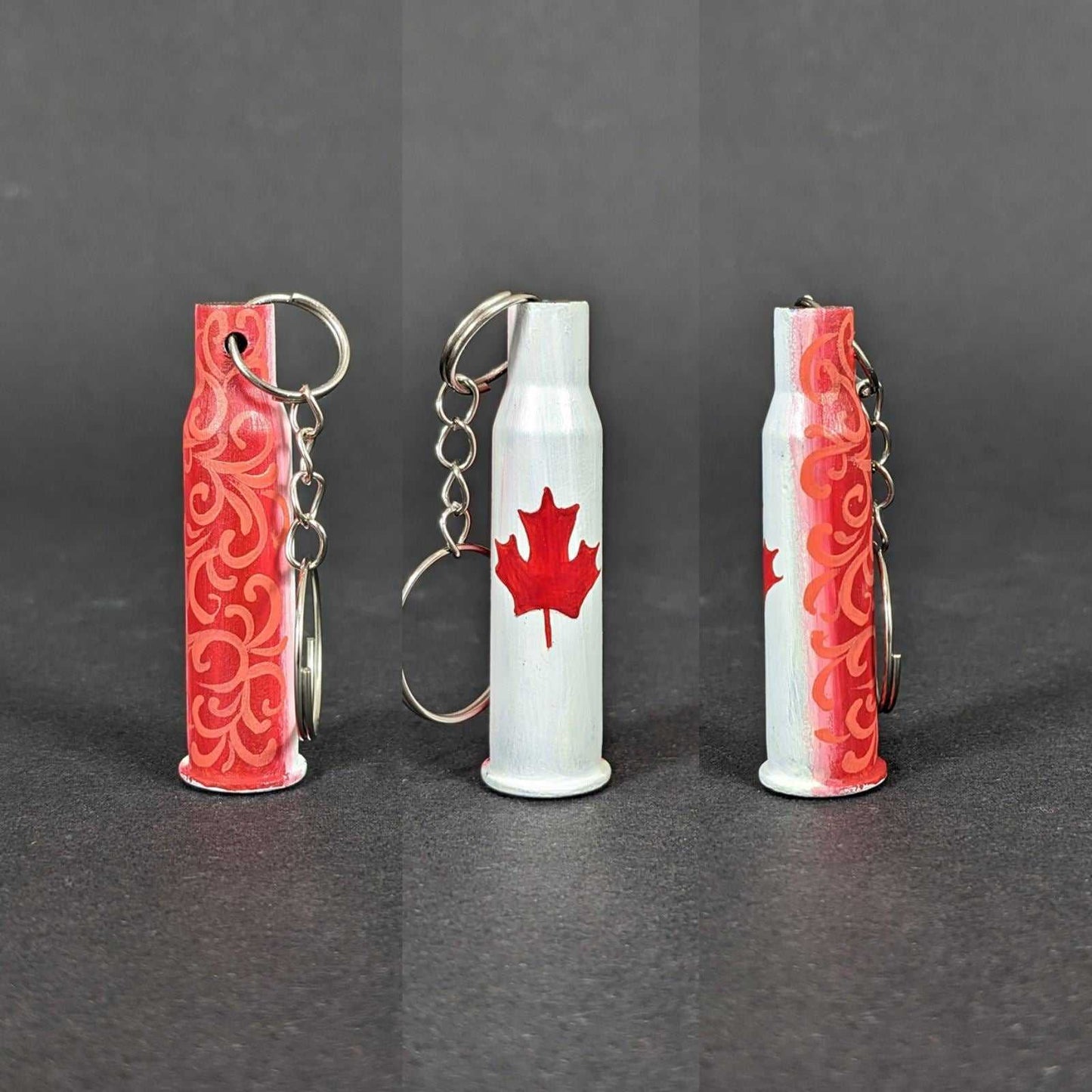 Small caliber keychain painted with Canadian flag colors representing Canada