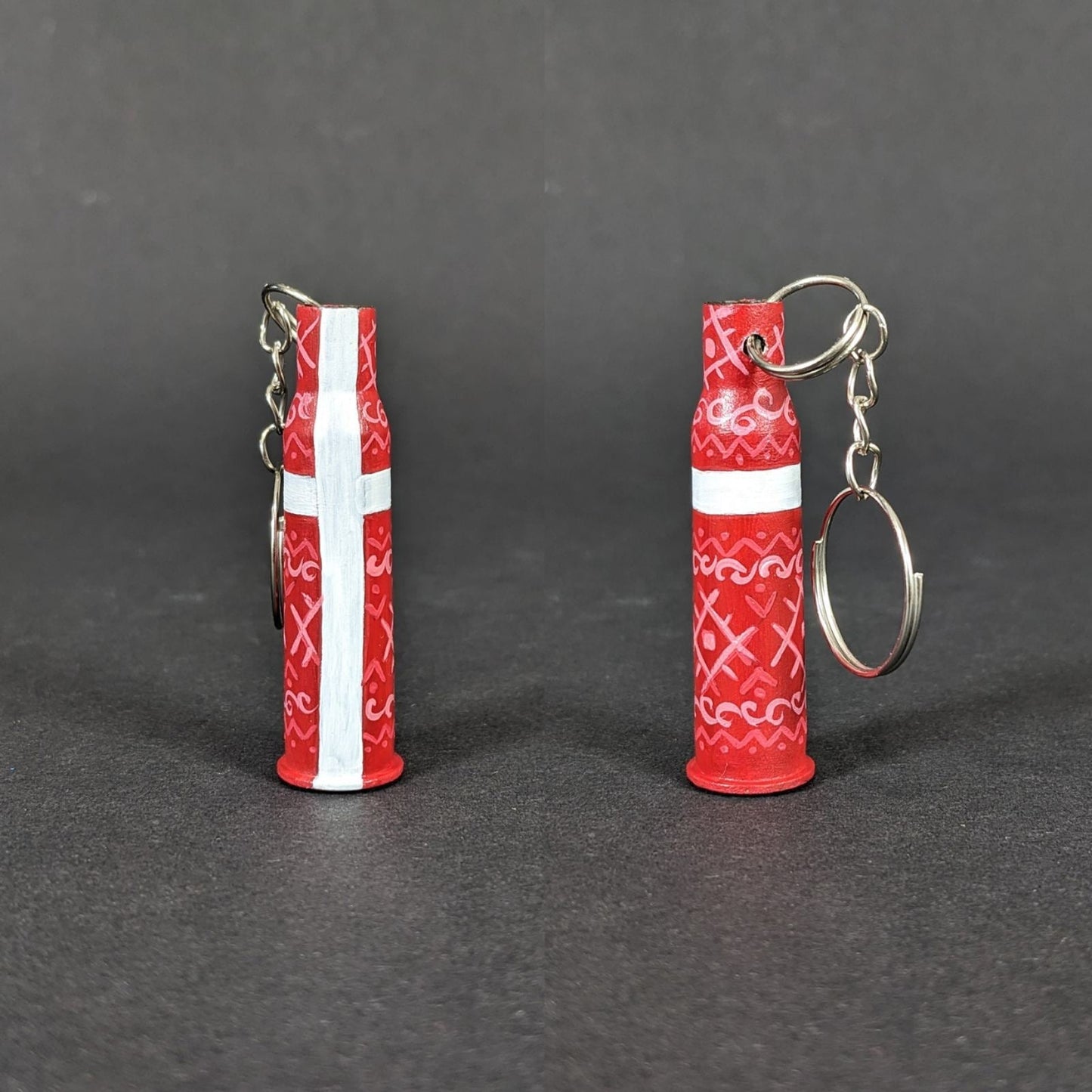 Small caliber keychain painted in Danish flag colors