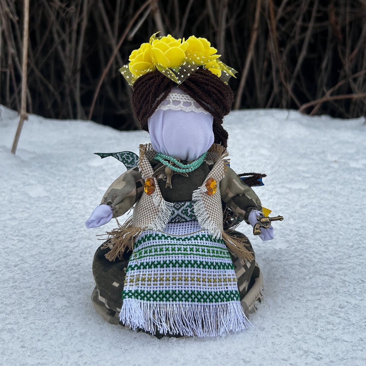 Handmade Ukrainian doll with traditional attire and embroidery