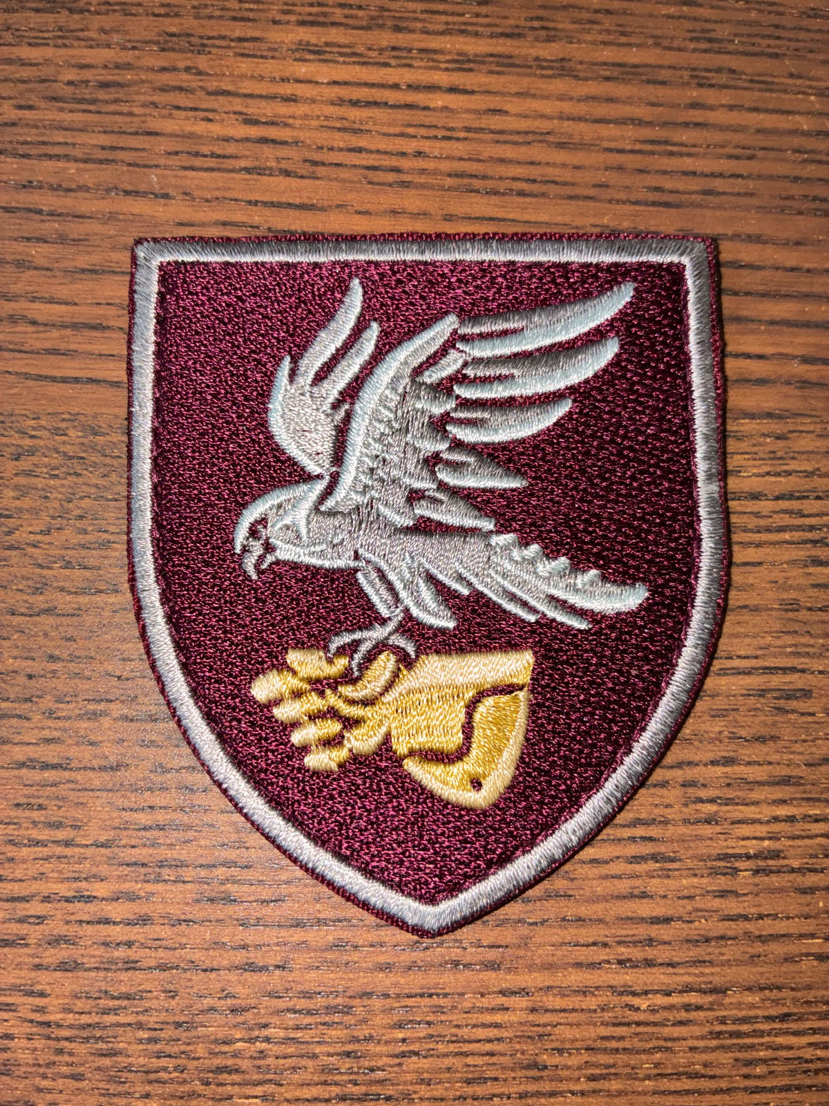 Patch - 421st Unmanned Systems Battalion burgundy embroidered shield with silver eagle and golden winged emblem