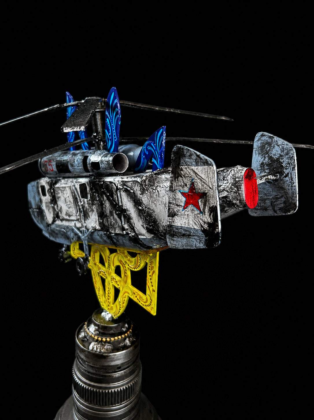 Destroyed KA-27 helicopter model impaled on Tryzub sculpture, designed by Hisoshi Art Studio and painted by Anastasia Leonova