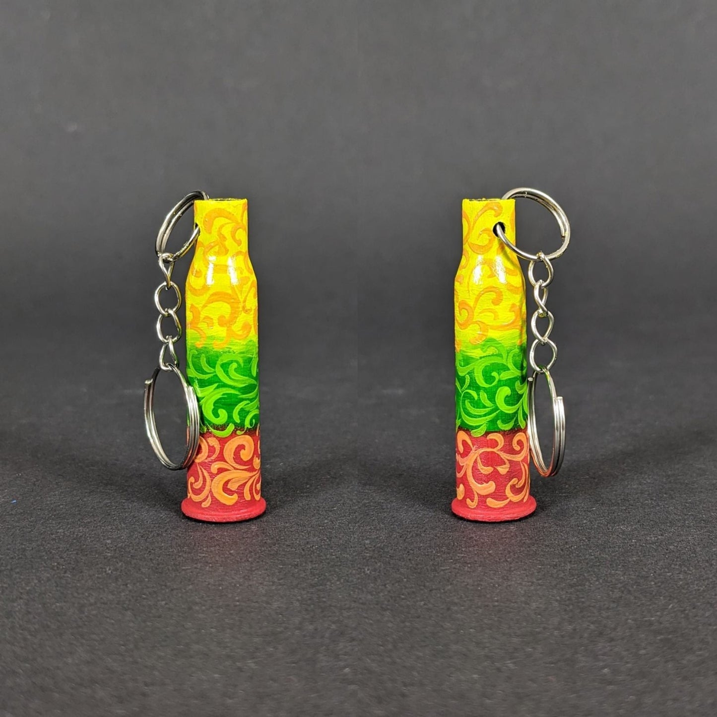 Small caliber keychain painted in Lithuania flag colors