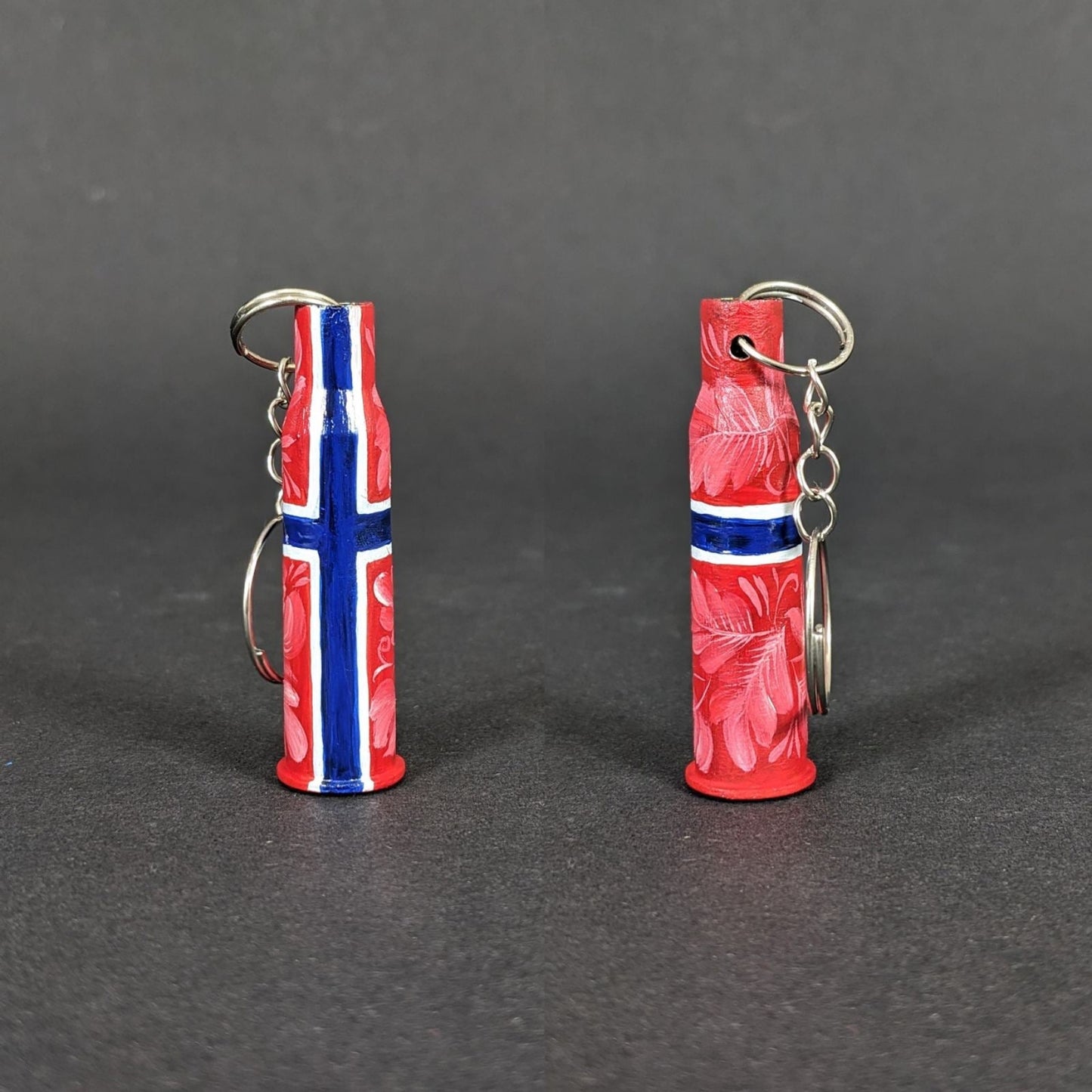 Small caliber keychain painted in Norwegian flag colors representing Norway