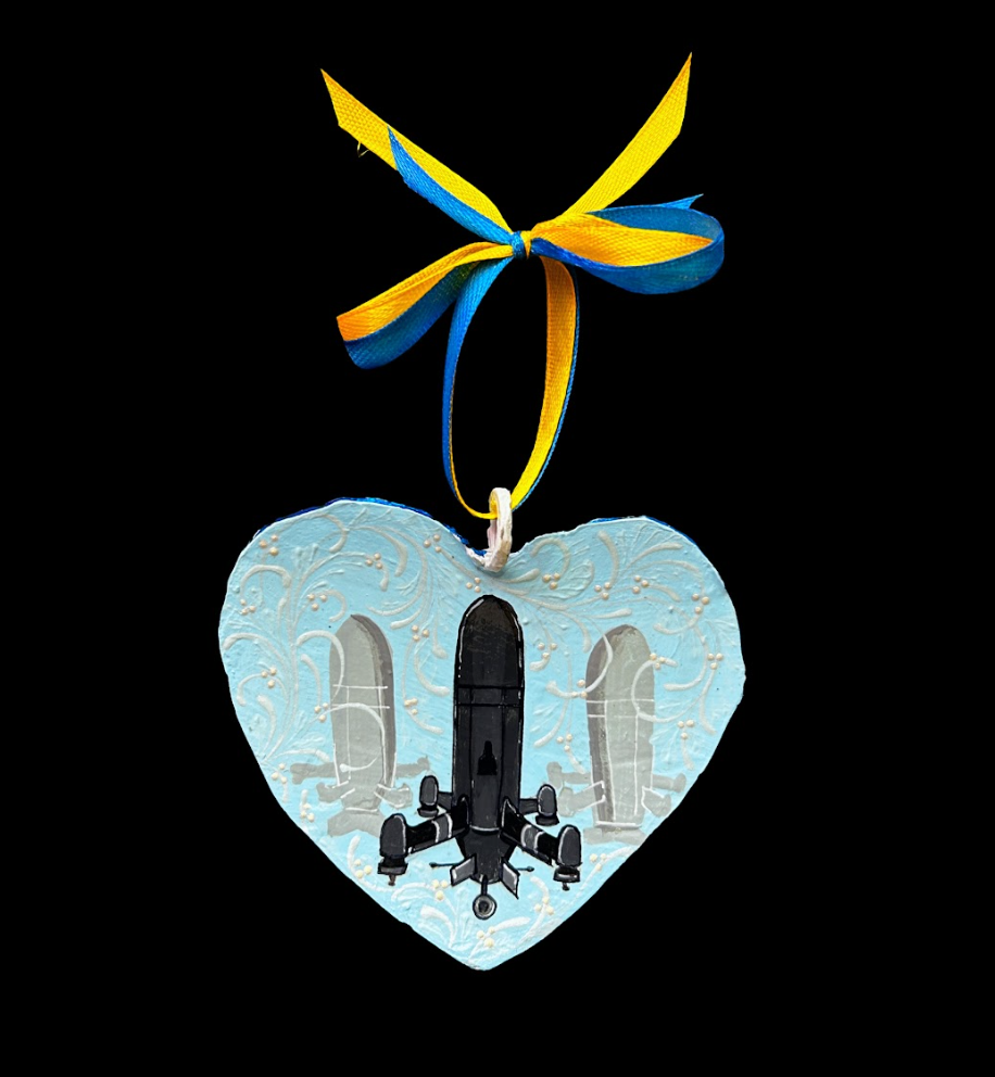 Ukrainian interceptor drone ornament crafted from 122mm grad rocket by Hisoshi Art Studio and painted by Anastasia Leonova