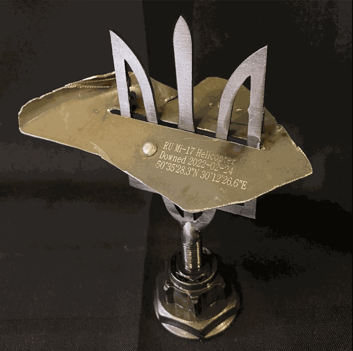 Large Tryzub with engraved MI-17 helicopter piece from Antonov Airport, designed by Ukrainian artists