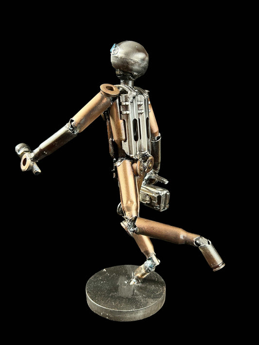 Sculpture of journalist created from small caliber shells by Lenny Pridatko, designed by Hisoshi Art Studio and painted by Anastasia Leonova.