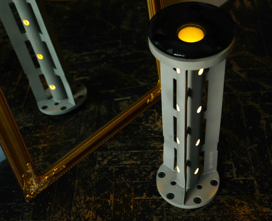 Rocket lamp made from 220 mm 9M27K1 cargo rocket symbolizing light overcoming darkness