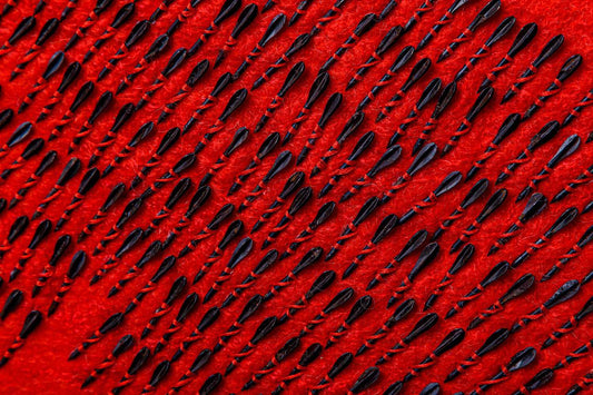 Air raid siren concept with Ukraine map made of red wool and 300 fletchettes symbolizing missile attacks