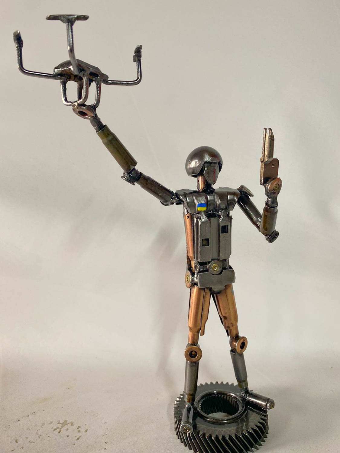 Sculpture of Ukrainian soldier launching a drone made from frontline shells, 27cm tall