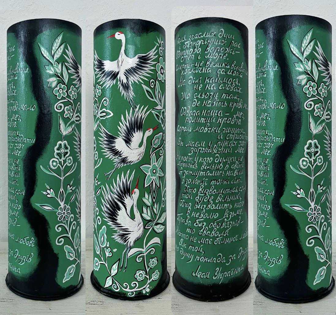 Large shell painted with Ukrainian storks and inspirational Ukrainian poem by Anna Huliaieva, 1356 AH, featuring Lesya Ukrainka quotes.