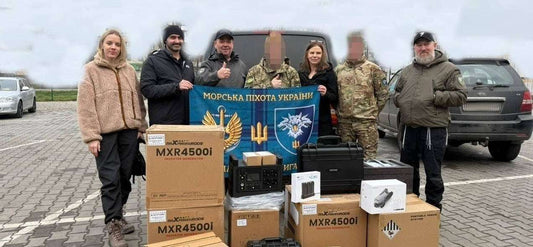 UAO volunteers unloading anti-drone camouflage nets for Ukrainian defenders using cutting edge technology