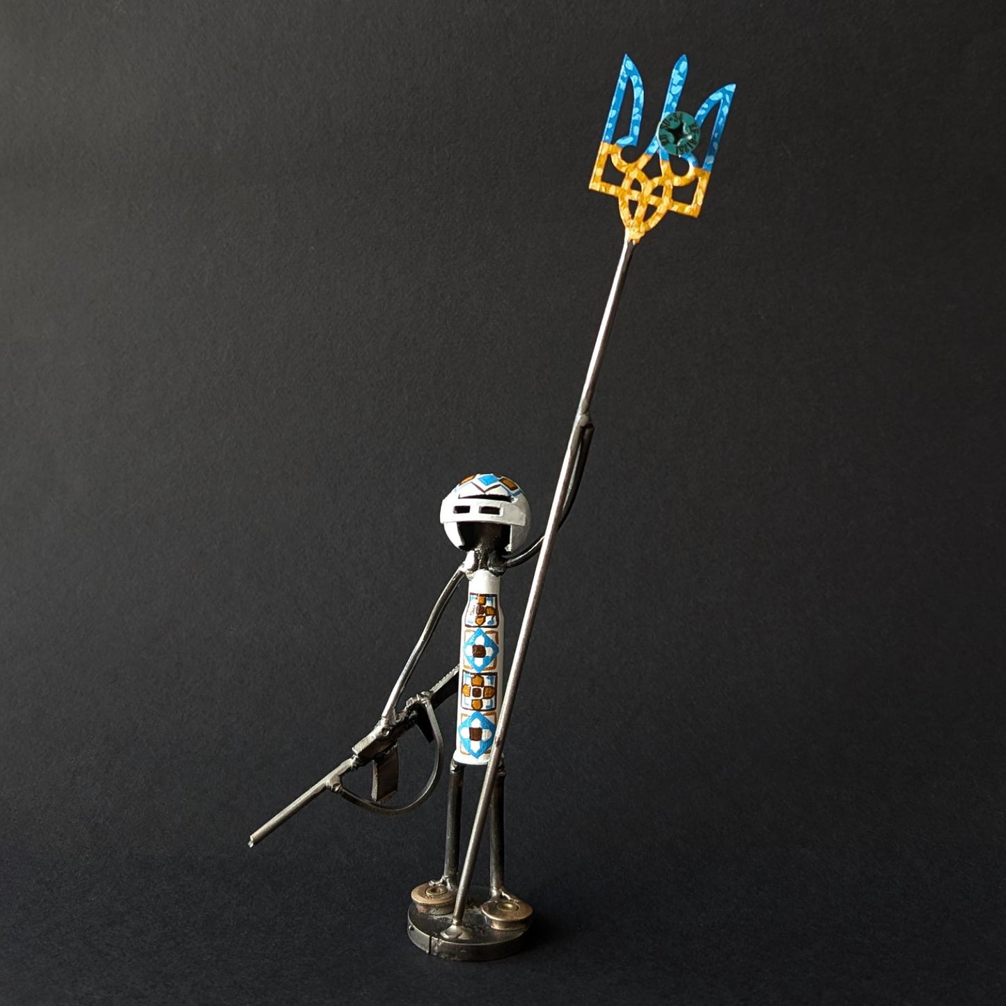 Mini-Soldier holding Tryzub with impaled screw from shot-down SU-34. (17cm tall). (1110 CR)