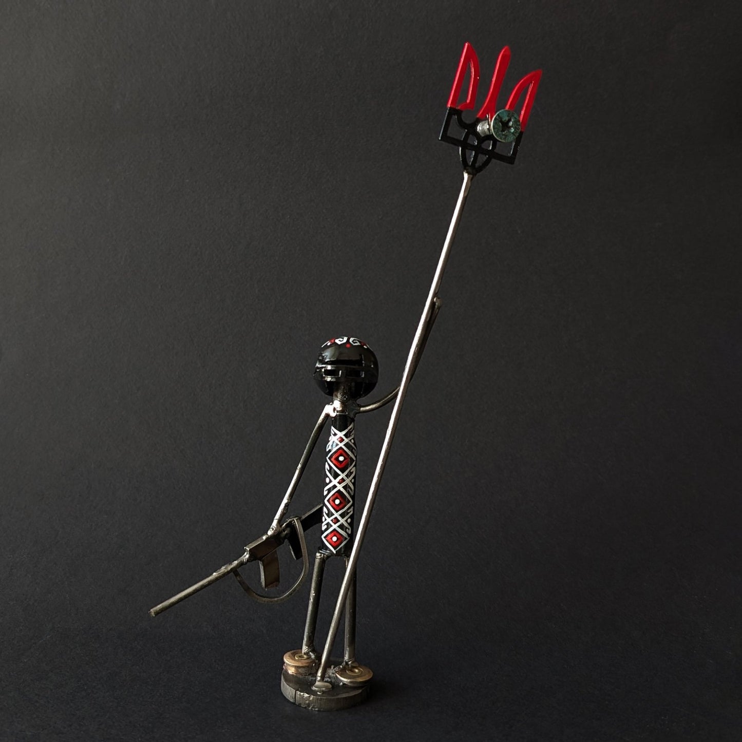 Mini-Soldier holding Tryzub with impaled screw from shot-down SU-34. (17cm tall). (1113 CR)