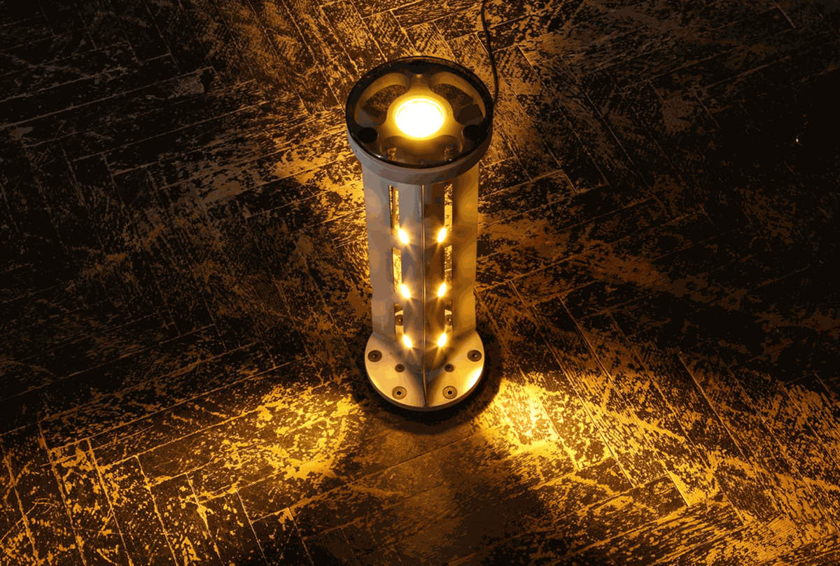 Rocket lamp made from 220 mm 9M27K1 cargo rocket symbolizing light overcoming darkness