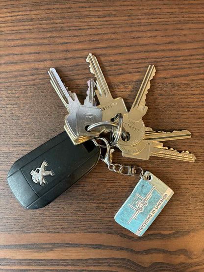 Engraved keychain made from a shot down SU-34 plane (RF-81879 - 24 Red, shot down near Kyiv in 2022)