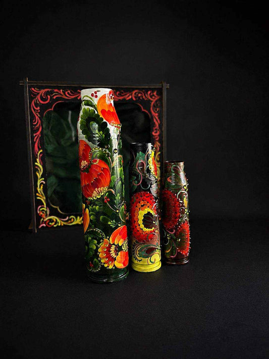 Set of 3 spent shells including 30mm shell in wooden box
