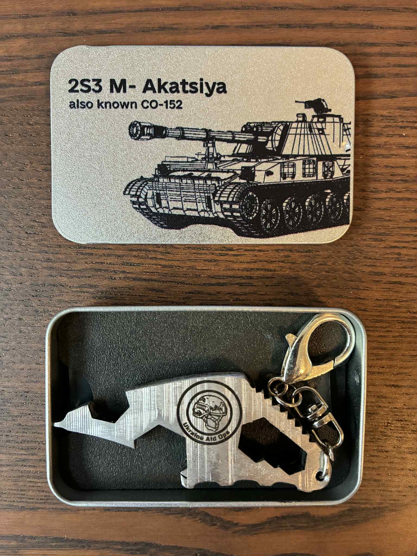 Engraved keychain (multi-tool device & bottle-opener) made from the barrel of a destroyed Russian 2S3 Akatsiya Self Propelled Howitzer
