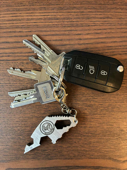 Engraved keychain (multi-tool device & bottle-opener) made from the barrel of a destroyed Russian 2S3 Akatsiya Self Propelled Howitzer