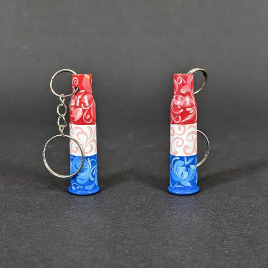 Small caliber keychain painted in Dutch flag colors.