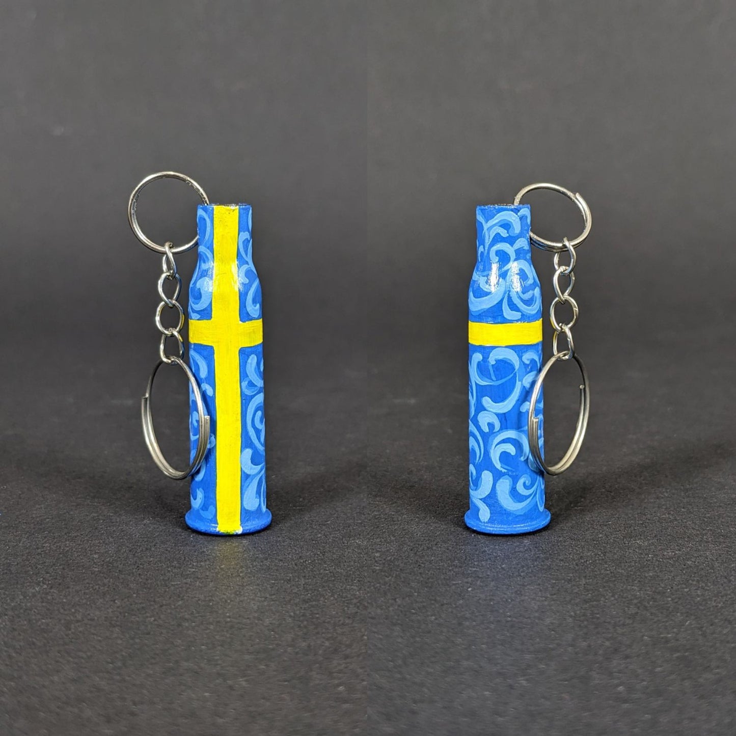 Small caliber keychain painted in Swedish flag colors.