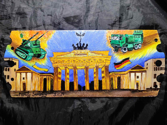 ".Thank you Germany." Painted on piece of destroyed russian tank. (31x15x1cm)