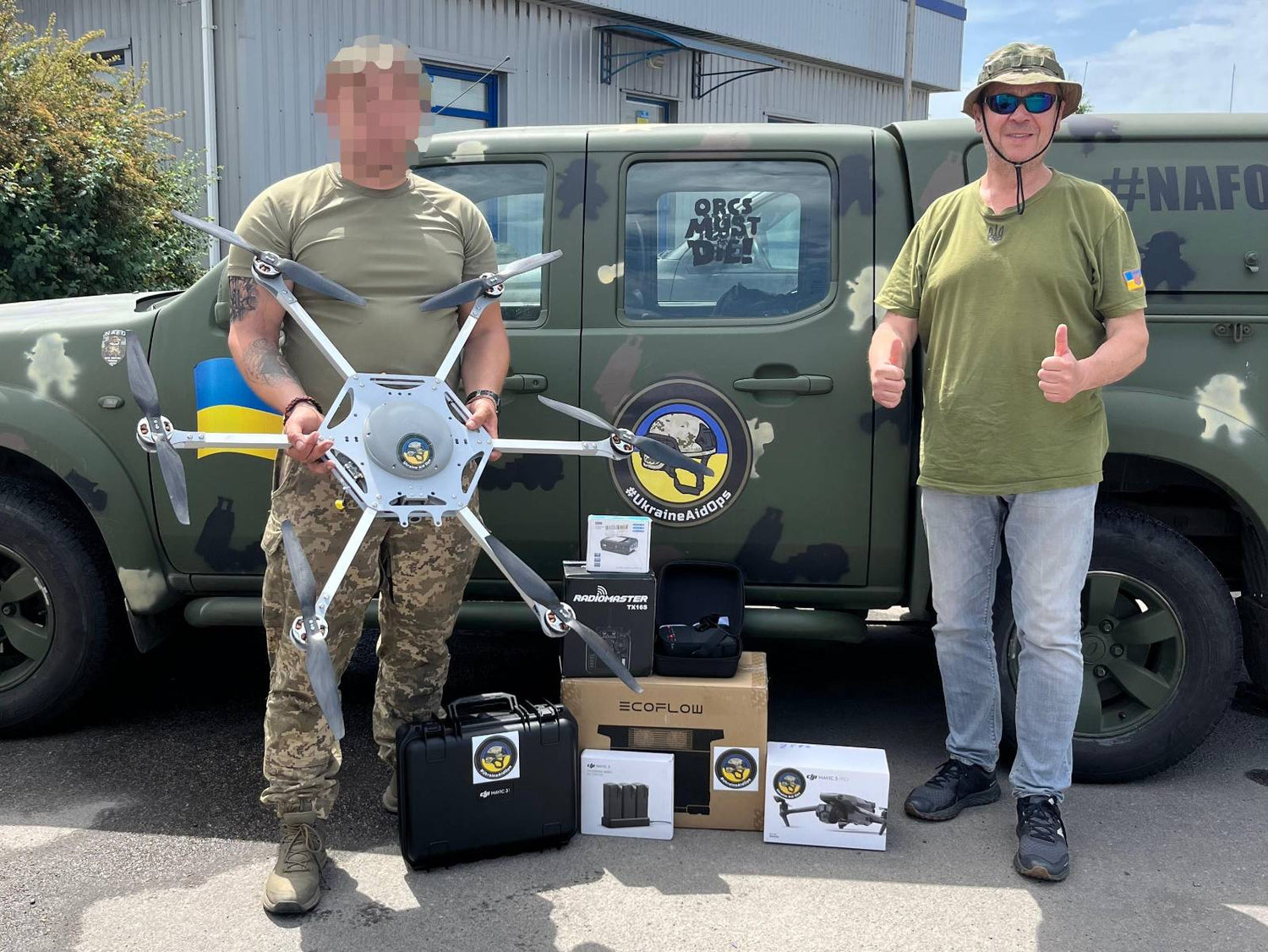 Yuri giving a drone to a Ukrainian soldier