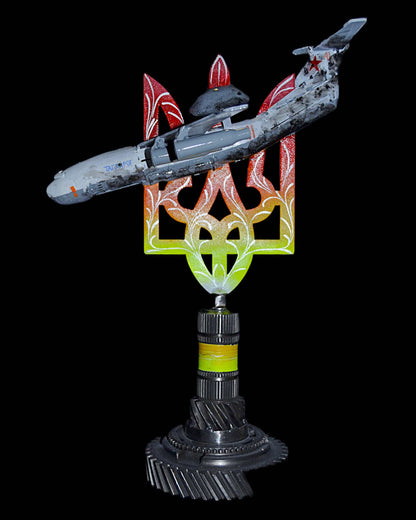 A50 early warning aircraft model impaled on 36cm Tryzub sculpture by Hisoshi Art Studio