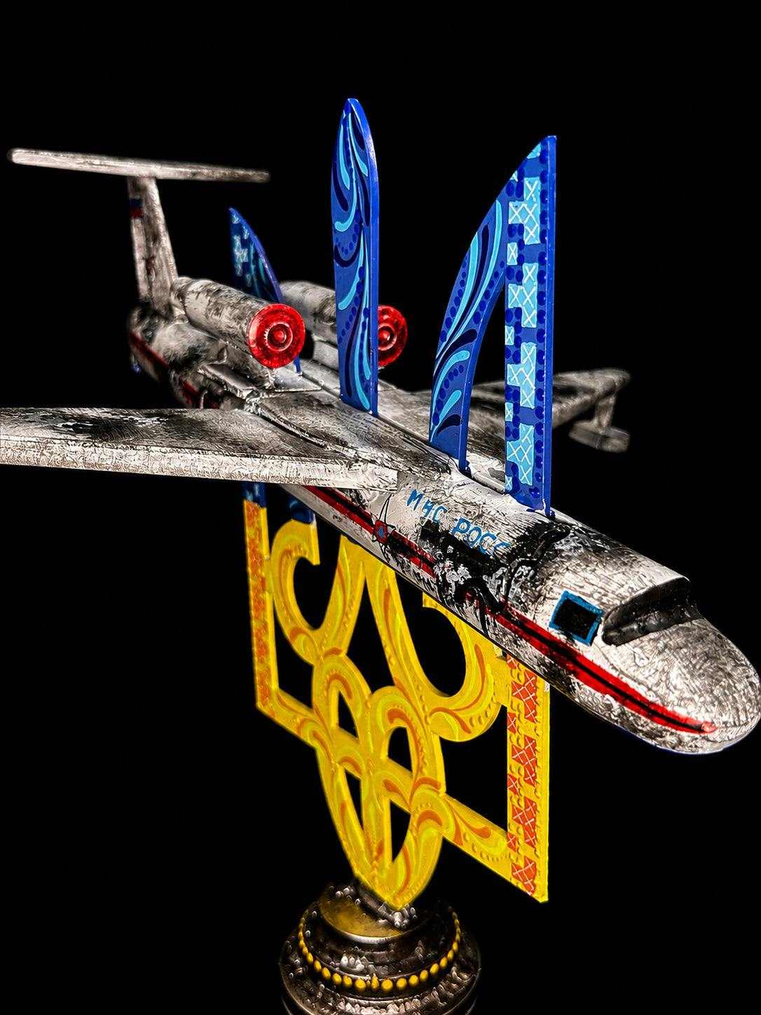 Destroyed Beriev Be-200 impaled on Tryzub sculpture artwork
