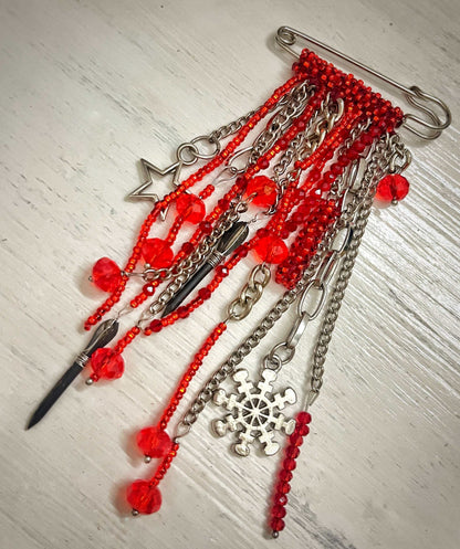 Brooch with flechette designed by Ukrainian artist Anna Huliaieva, 11-12cm long recovered in Kyiv Oblast 2022