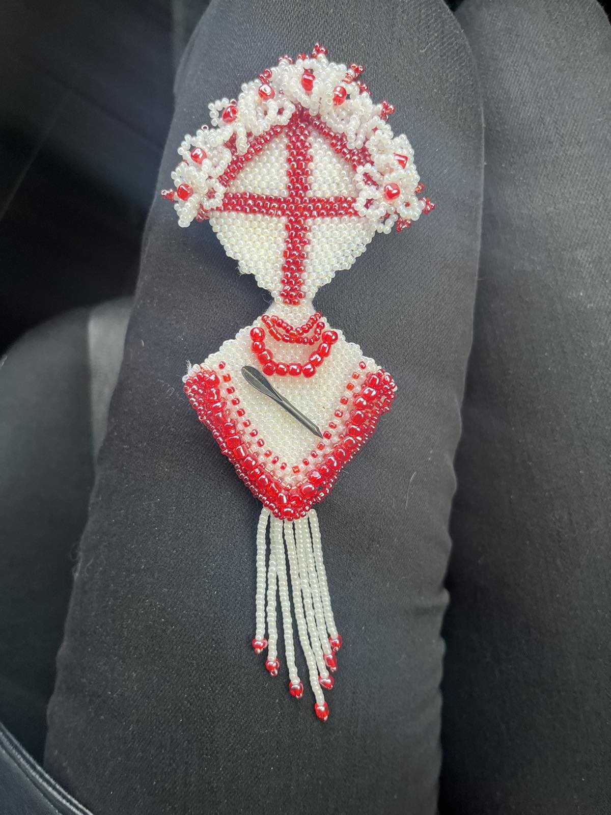 Brooch with flechette designed by Ukrainian artist Anna Huliaieva, recovered in Kyiv Oblast 2022