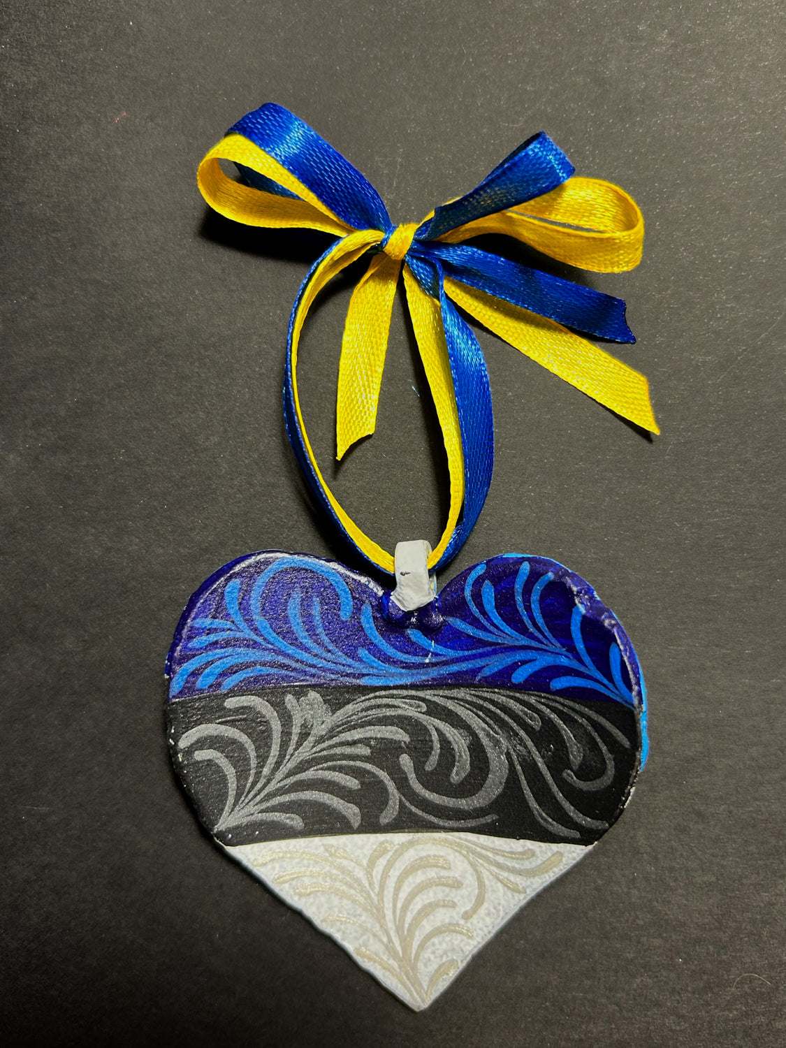 Iron Heart ornament painted with Estonian and Ukrainian flags made from 122mm grad rocket from Estonia