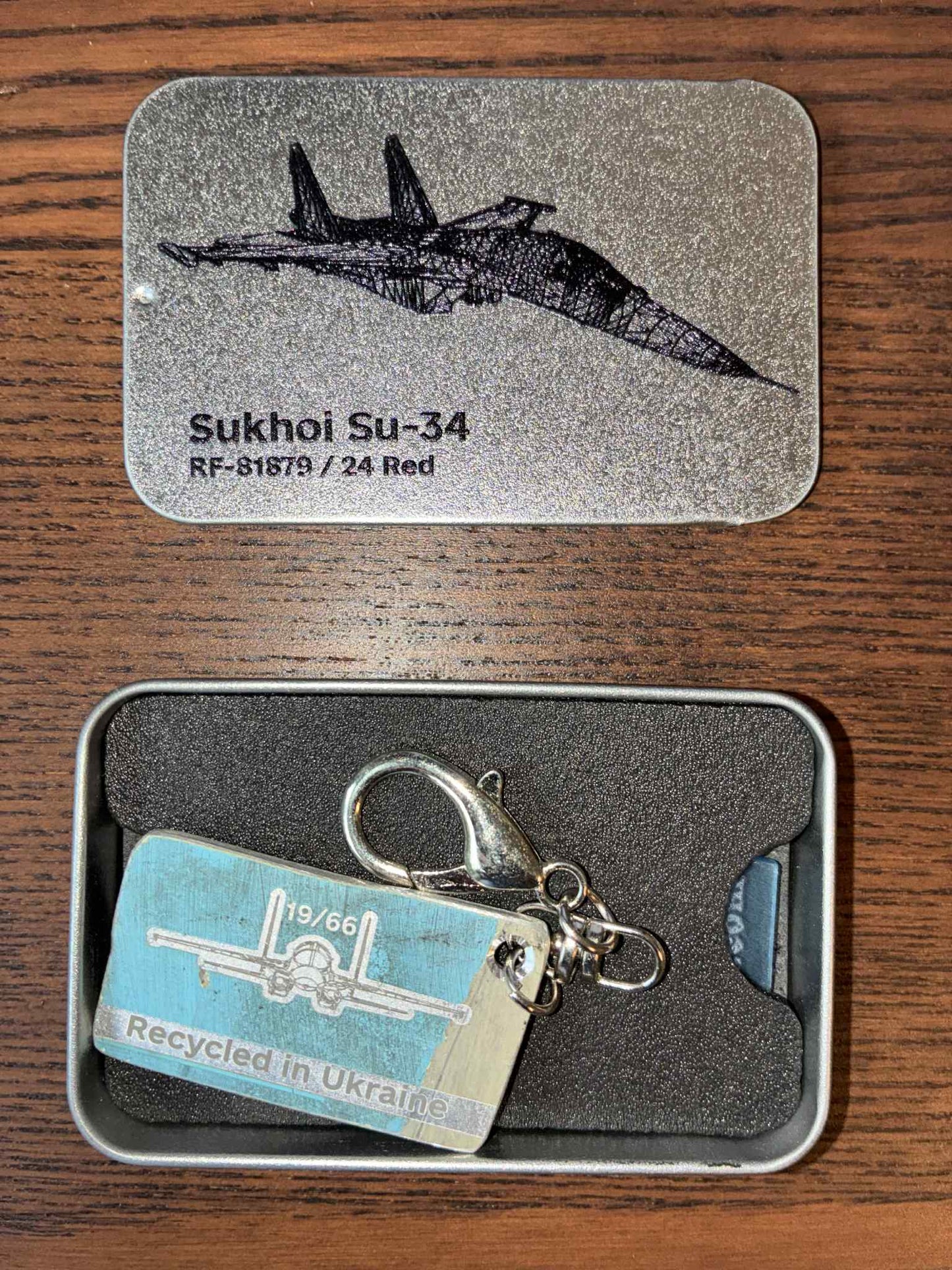 Engraved keychain made from a shot down SU-34 plane (RF-81879 - 24 Red, shot down near Kyiv in 2022)