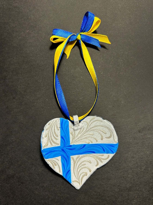 Iron Heart ornament painted with Finnish and Ukrainian flags made from 122mm grad rocket