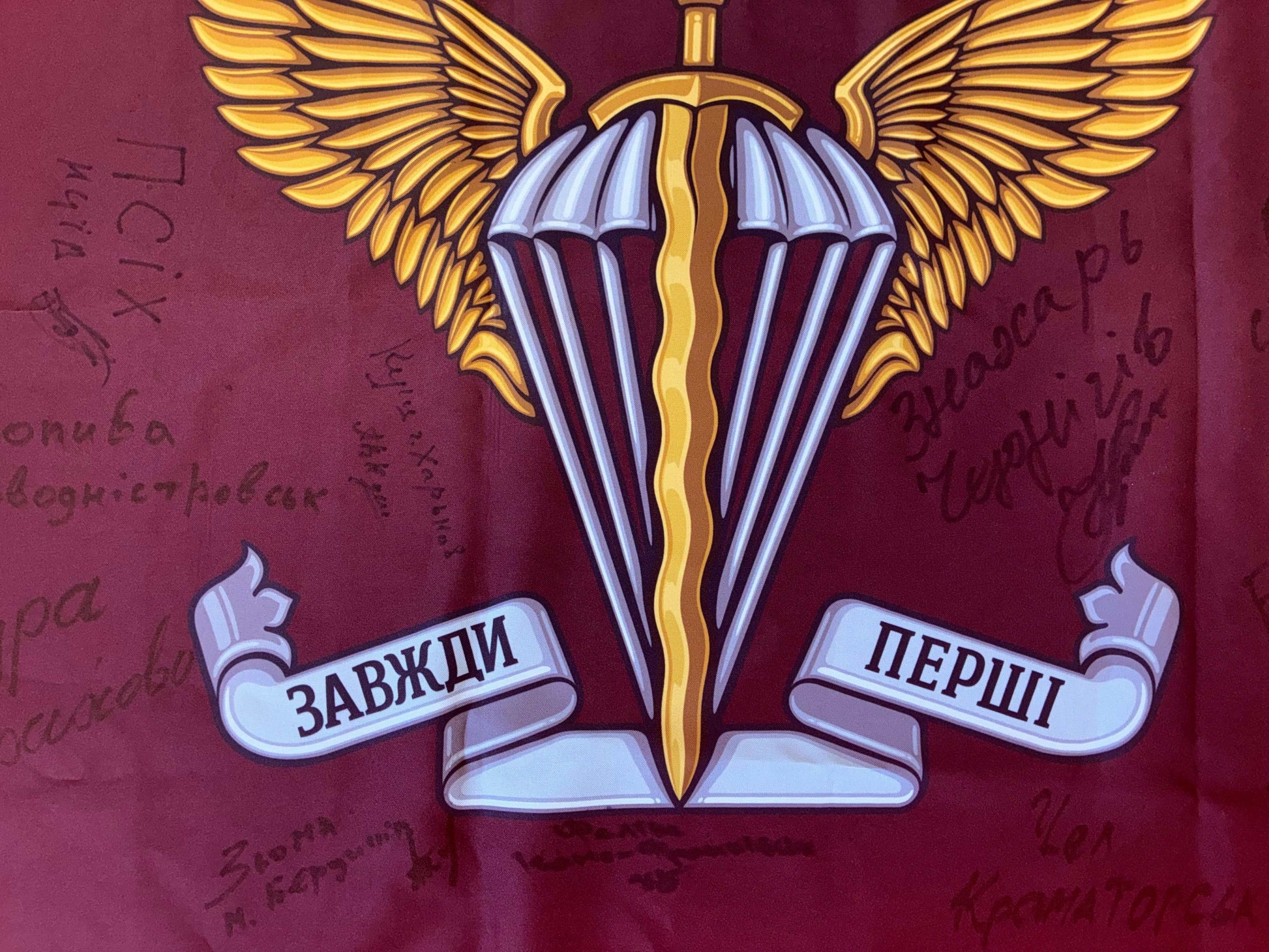 Flag 82nd Air Assault Brigade with signatures of Ukrainian warriors for donation fundraising