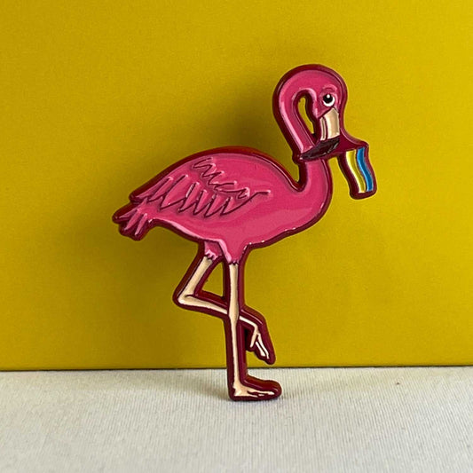 Flamingo pin holding Ukrainian flag in beak