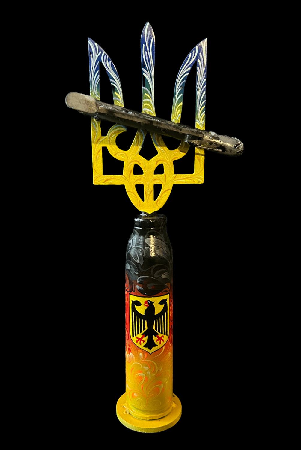 Shaheed drone impaled on Tryzub mounted on Gepard shell artwork from Germany