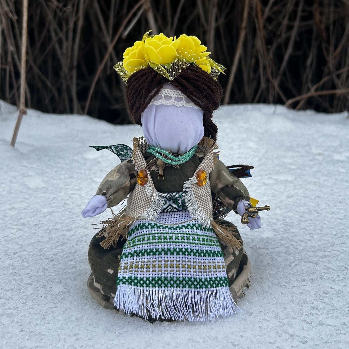 Handmade Ukrainian doll with traditional attire and embroidery