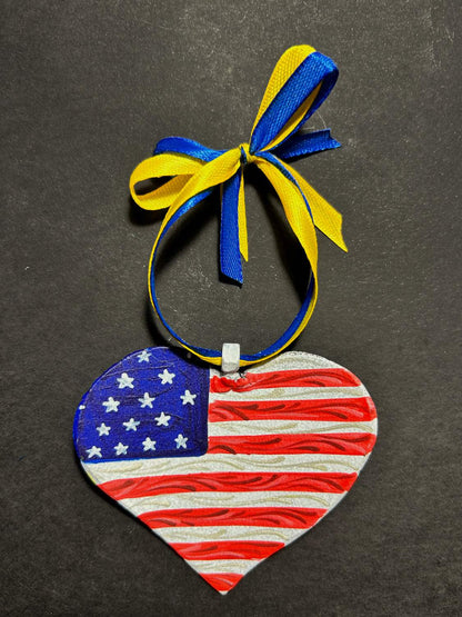 Iron Heart ornament painted in American and Ukrainian flag colors made from 122mm Grad rocket