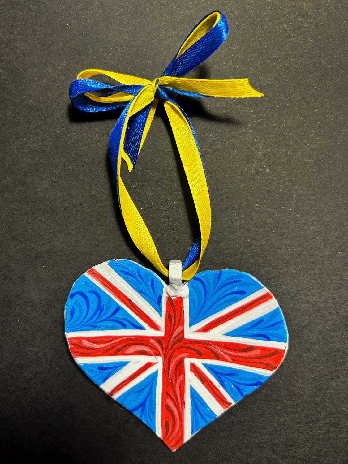 Iron Heart ornament painted with British and Ukrainian flags made from 122mm grad rocket