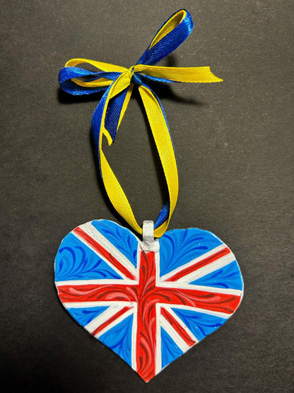 Iron Heart ornament painted with British and Ukrainian flags made from 122mm grad rocket
