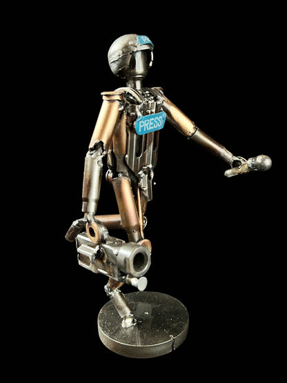 Sculpture of journalist created from small caliber shells by Lenny Pridatko, designed by Hisoshi Art Studio and painted by Anastasia Leonova