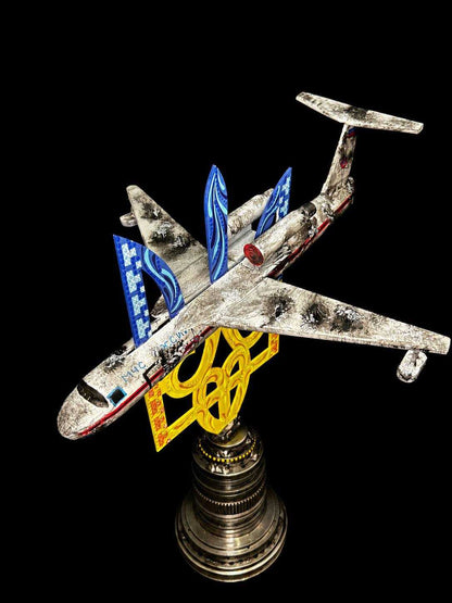 KA-52 attack helicopter model with destroyed Beriev Be-200 impaled on Tryzub sculpture