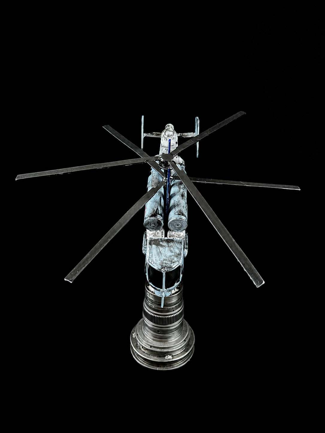 Destroyed KA-27 helicopter model impaled on Tryzub sculpture by Hisoshi Art Studio