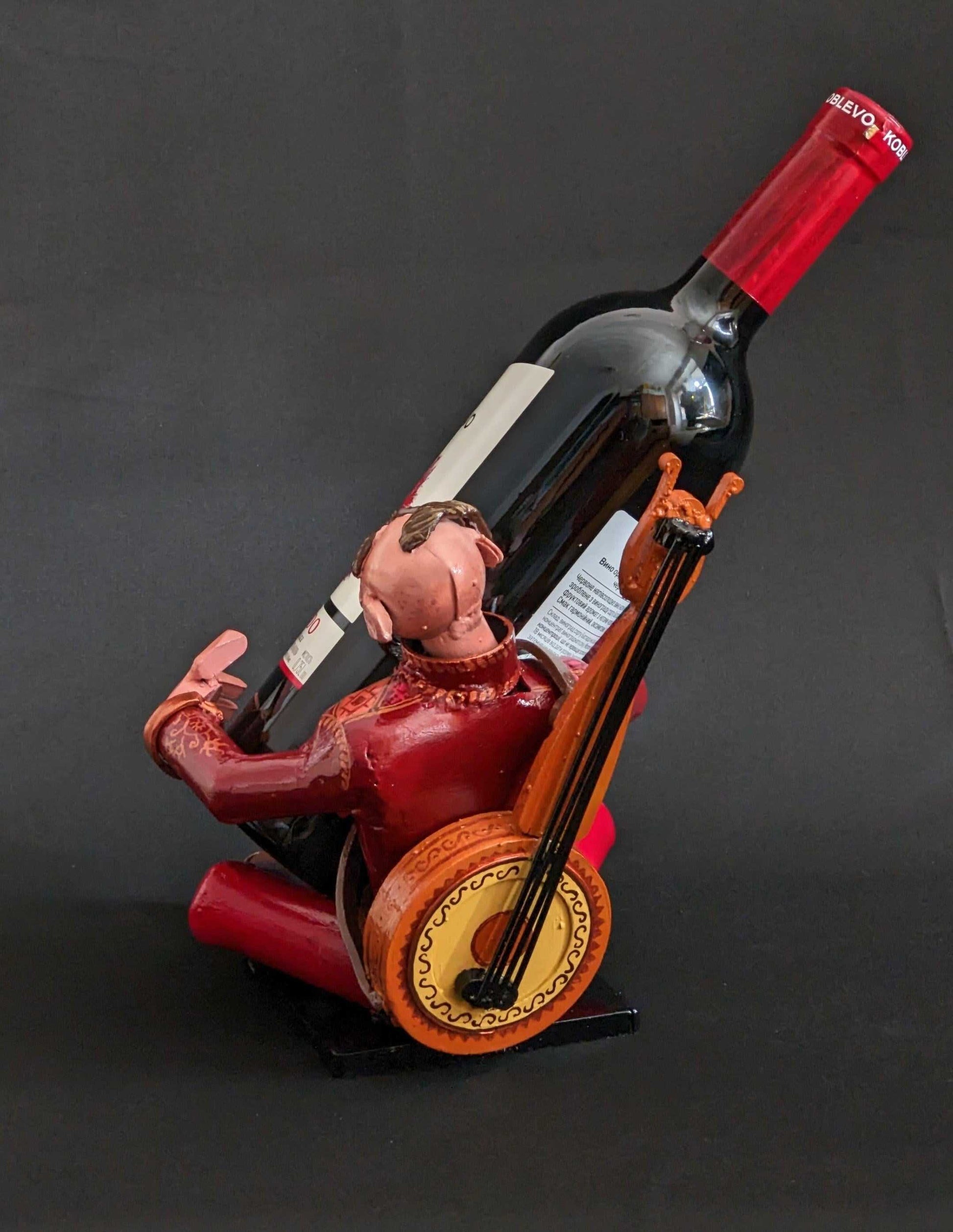 Kozak Wine Holder handcrafted from frontline shells by Hisoshi Art Studio and painted by Catherine Ruban