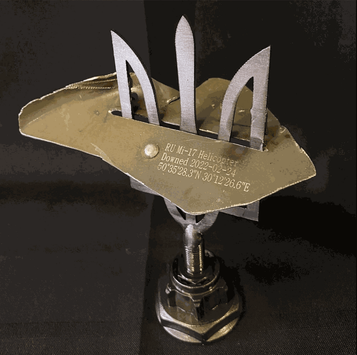 Large Tryzub with engraved MI-17 helicopter piece from Antonov Airport, designed by Ukrainian artists