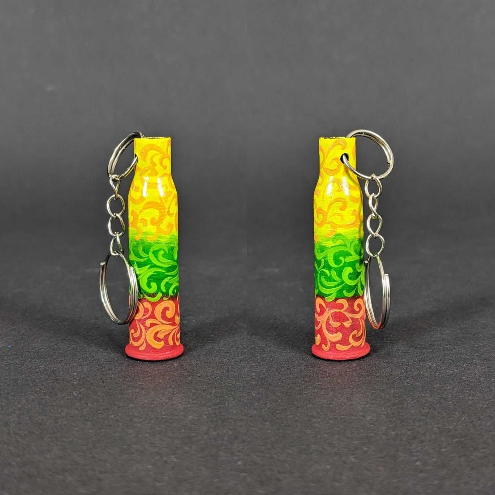 Small caliber keychain painted in Lithuania flag colors